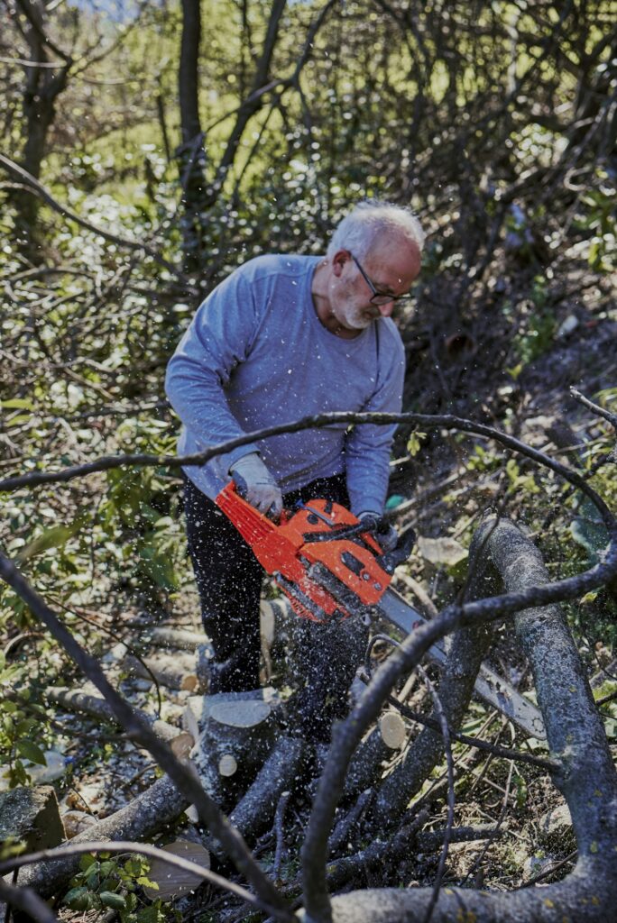 an old man chopping wood